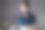 亚洲妇女在蓝色衬衫戴着保护面罩自信地把她的拳头放在左胸显示信任和在办公室。孤立的背景。图片下载