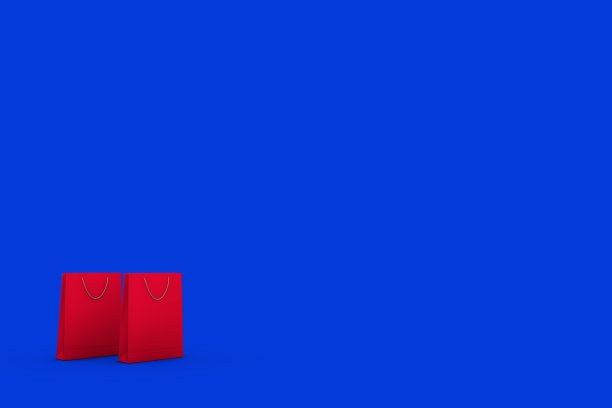 蓝色背景下的红色包包图片下载