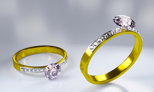 镶有各种大小钻石的金戒指，放在地板上，以白色为背景。三维渲染图片下载