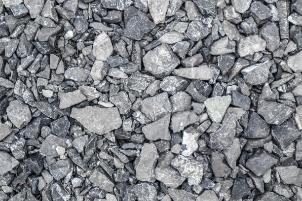 灰色的地面石，碎石的背景有许多小石块。图片下载
