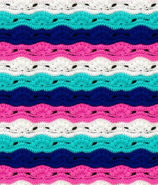 无缝针织质地。用多种颜色的线编织成波浪的图案。腈纶纱。花卉图案。图片下载