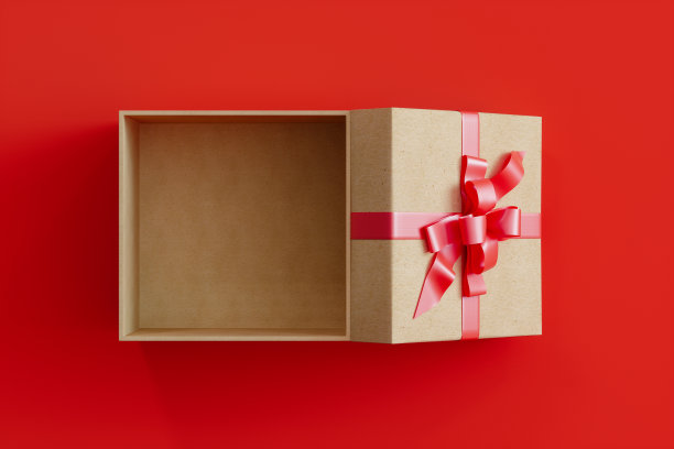 打开礼盒与丝带和蝴蝶结在红色的背景图片下载