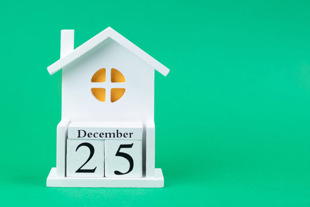 12月25日圣诞节在现代风格的绿色背景上。图片下载