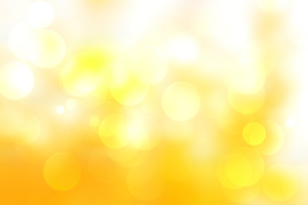 抽象的黄色背景。暖色调背景。用圆的形状看起来像散景。金色调中的黄色。就像用来庆祝季节。图片下载