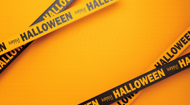 黄色背景上写着黑色丝带的万圣节快乐图片下载