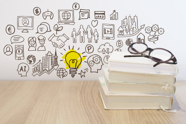 通过阅读来学习各种知识——智能手机、电脑、网络和商业理念。图片下载