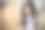 一个穿着灰色睡衣的漂亮的黑发女孩在秋千上放松。可爱的黑发女孩在家里的编织椅摇摆。看着摄像机。特写,柔软的焦点。图片下载