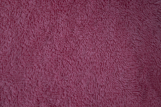 粉色织物，毛巾布，有纹理的背景。适用于设计纸张、背景文字、图片、广告牌、宣传册图片下载