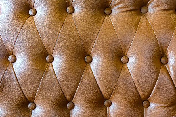 棕色沙发纹理。豪华沙发皮革的图案和表面。图片下载