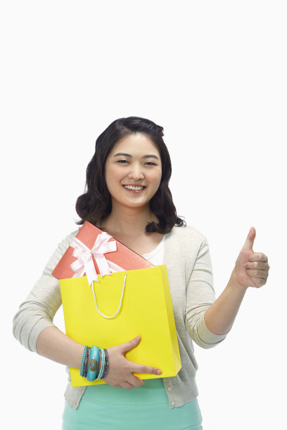 女人微笑着竖起大拇指图片下载