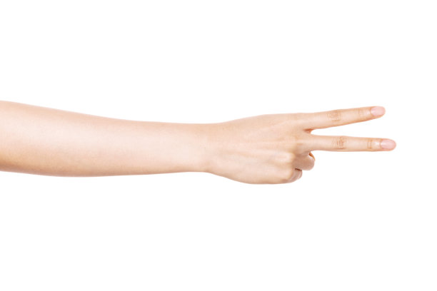 女人的手势剪刀孤立在白色。图片下载