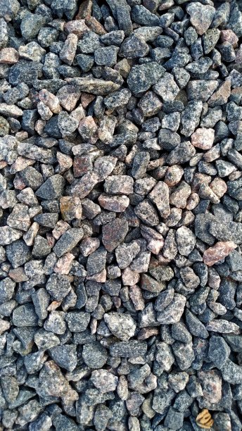 花岗岩，用于建筑的岩石，砾石质地的石材图片下载