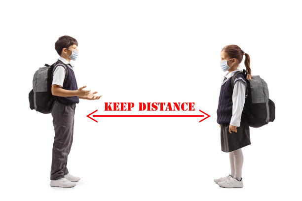 一个男学生和一个女学生戴着面具并保持距离的完整的侧面照片图片下载