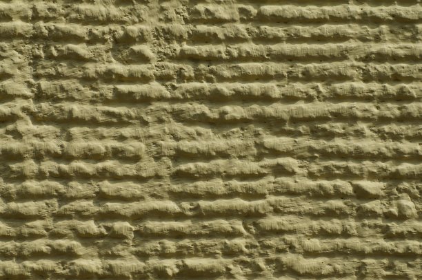 建筑的外立面，带有清晰纹理的石膏，抽象的背景以文字为主图片下载