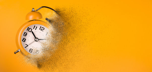 溶解橙色闹钟。图片下载