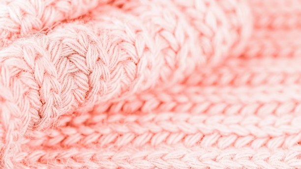 时髦的珊瑚的颜色。羊毛针织图案。微妙的和明亮的。16：9图片下载