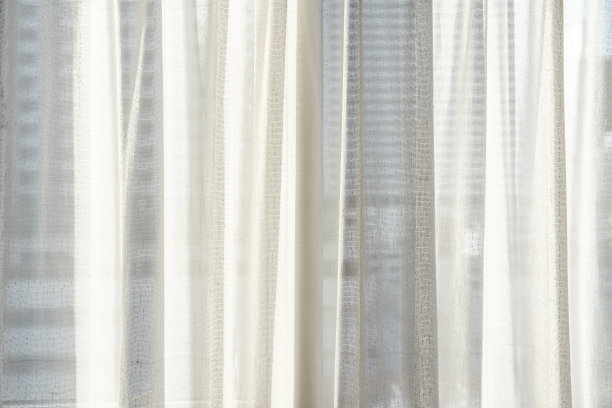 特写的白色窗帘与明亮的阳光图片下载