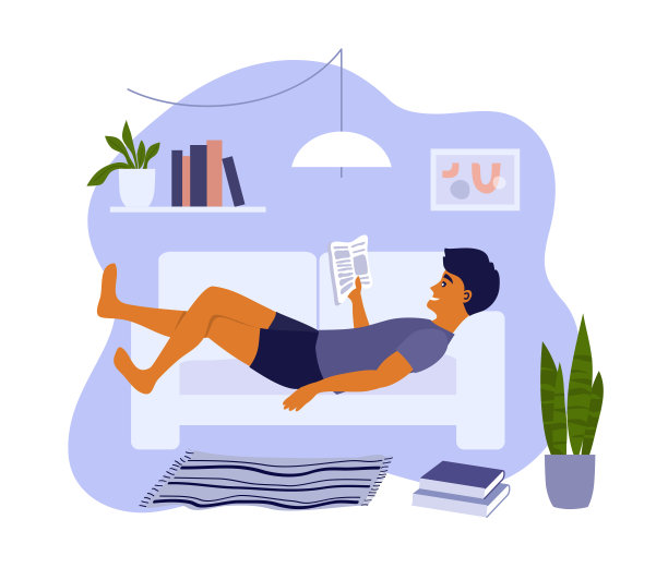 年轻人躺在家里的沙发上，放松和阅读书籍或杂志图片下载