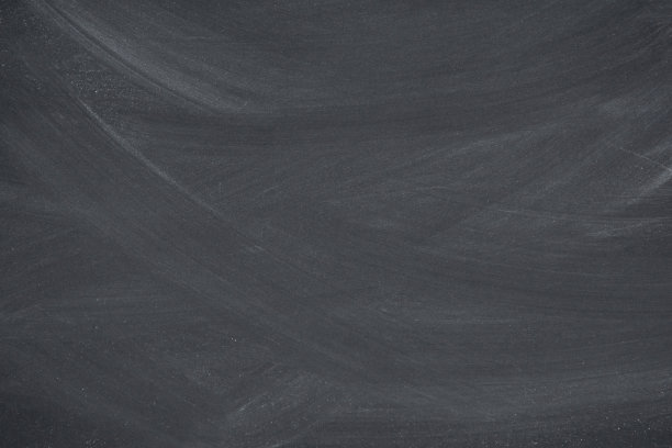 粉笔擦在黑板上，黑板的纹理背景复制空间添加文字和设计图片下载