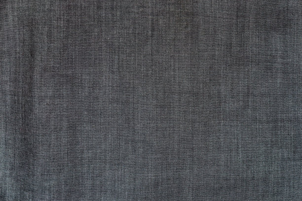 接近黑色或棕色的织物纹理。纺织品的背景。图片下载