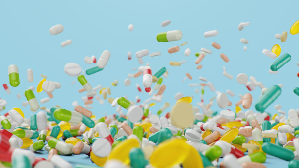 落下不同颜色的药片，胶囊在蓝色的背景。卫生保健的概念。药片里有抗生素，还有维生素。产品从药店。制药公司，行业，3d插画图片下载