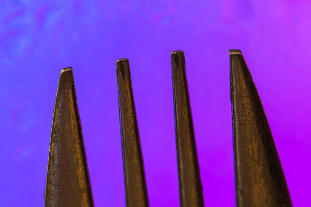 抽象的叉子细节在多彩的表面。抽象的背景概念图片下载