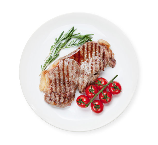 西冷牛排配迷迭香和樱桃番茄图片下载