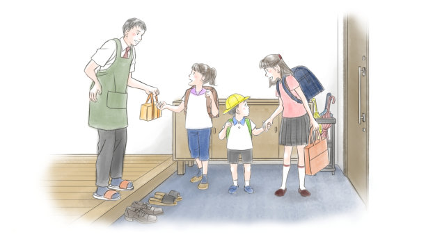 一位年轻的父亲送他的孩子们到门口素材图片