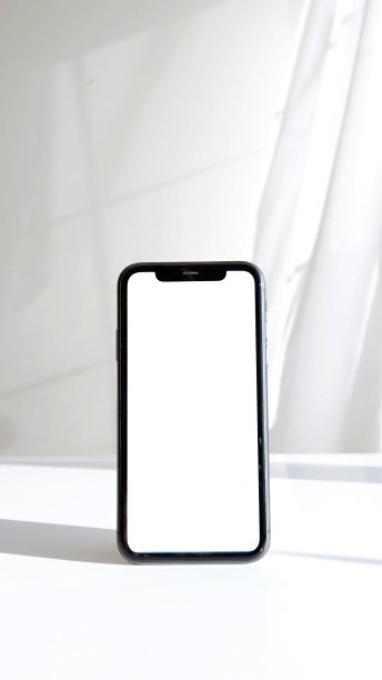 白色背景下的黑色智能手机的垂直照片图片下载