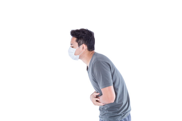 病人戴上卫生口罩，胃痛。图片下载