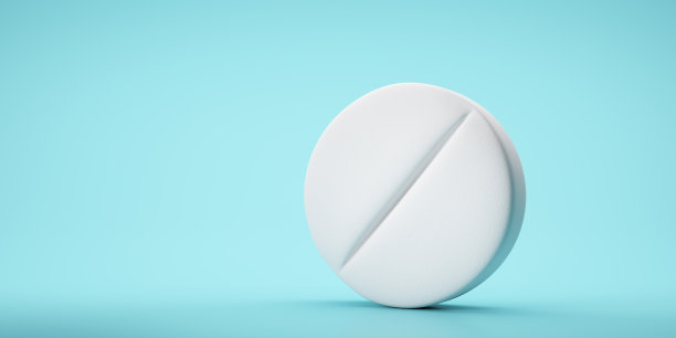 蓝色背景上的白色药丸图片下载