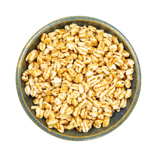 盛有膨化的蜂蜜小麦谷物的Stoneware碗图片下载