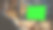 过肩:有创意的年轻人坐在他的办公桌上使用桌面电脑与模型的绿色屏幕。晚上在时尚的办公室工作室与城市窗户景观图片下载
