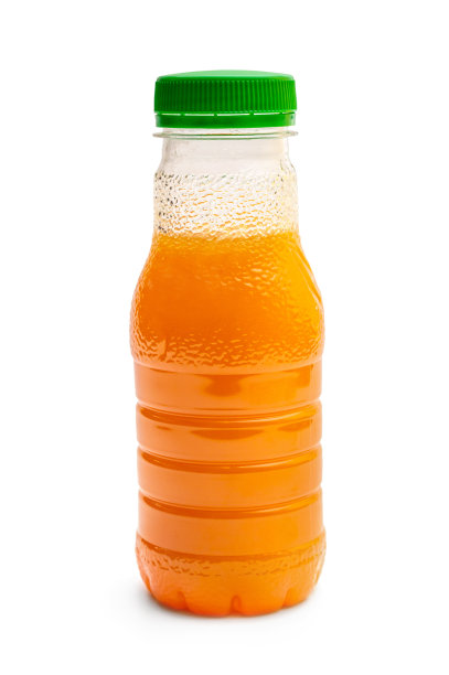 白色背景上的橙汁塑料瓶。图片下载