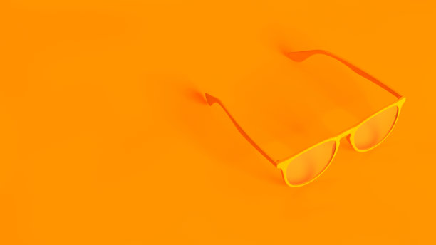 立体图像的概念。橙色背景上孤立的眼镜。图片下载