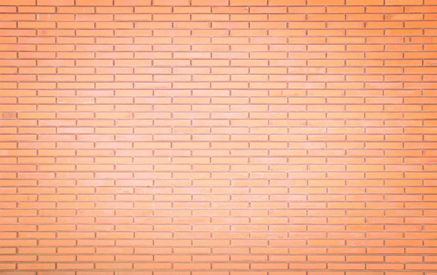 背景是宽大的老红砖墙纹理。旧橙色砖墙混凝土或石墙有纹理，墙纸石灰石抽象地板/网格不平的室内岩石。家庭或办公室设计背景。图片下载