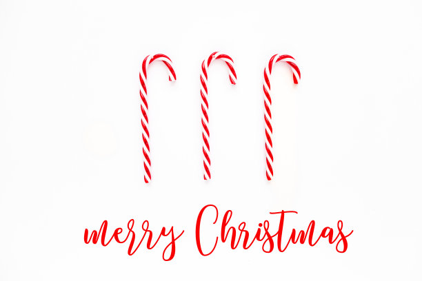 圣诞贺卡和拐杖糖。白色背景上的糖果。平躺，俯视图图片下载
