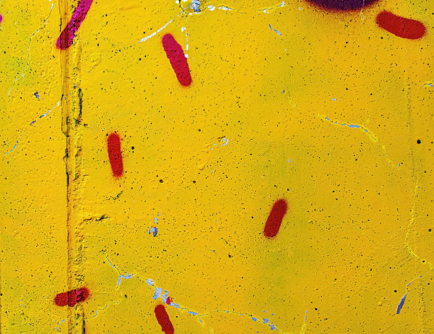 涂有纹理的墙面上有黄色和红色的斑点。抽象背景，复制空间图片下载