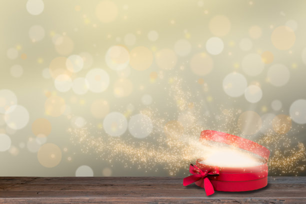 红色打开发光的礼物盒与魔法光线和星星。圣诞节的背景。图片下载