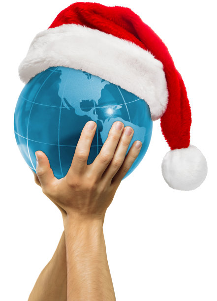 全球圣诞-地球在圣诞老人的帽子在男性手中(北美视图)图片下载