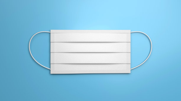 蓝色背景上的空白白色外科口罩图片下载
