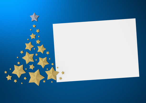 圣诞树由金色的星星在蓝色的背景与空间为您的文本图片下载