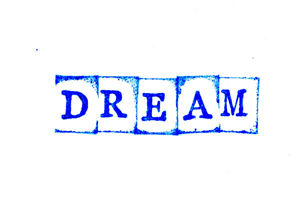 蓝色油墨的橡皮图章字梦在白纸背景上图片下载