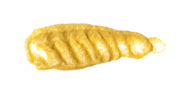 芥末酱飞溅隔离，涂抹第戎蜂蜜奶油图片下载