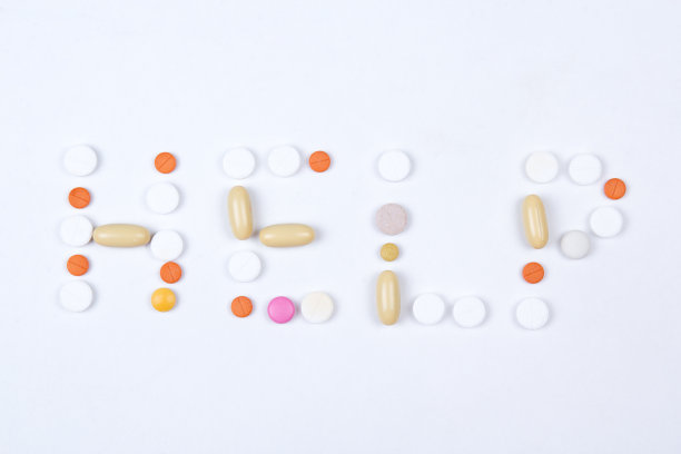 帮助文字的彩色药片，药丸和胶囊图片下载