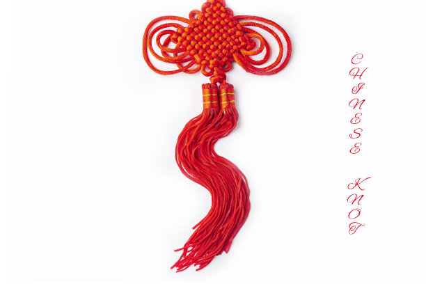 中国传统的神秘结。白色背景上手工制作的幸福与无限的红结。文本复制空间图片下载