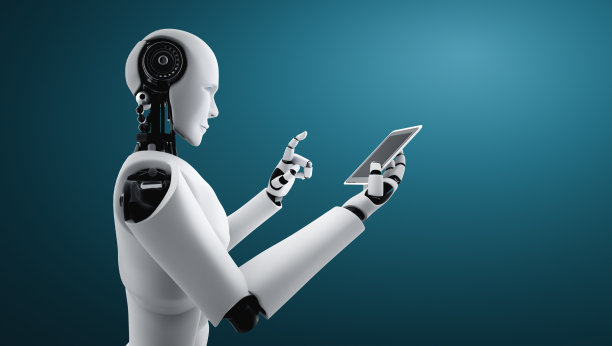 仿人机器人在未来的办公室使用手机或平板电脑图片下载