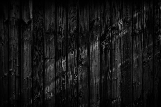 黑色木制背景。黑板上。枯燥乏味的纹理图片下载