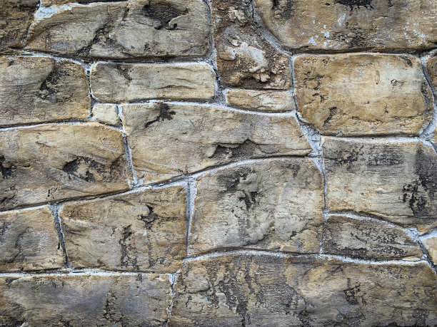 质朴的石头手工制作的墙壁背景图片下载