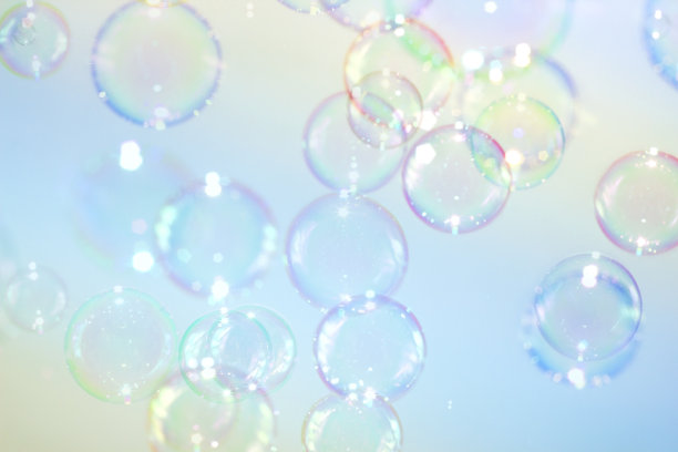 美丽多彩的彩虹香皂泡沫纹理背景。图片下载